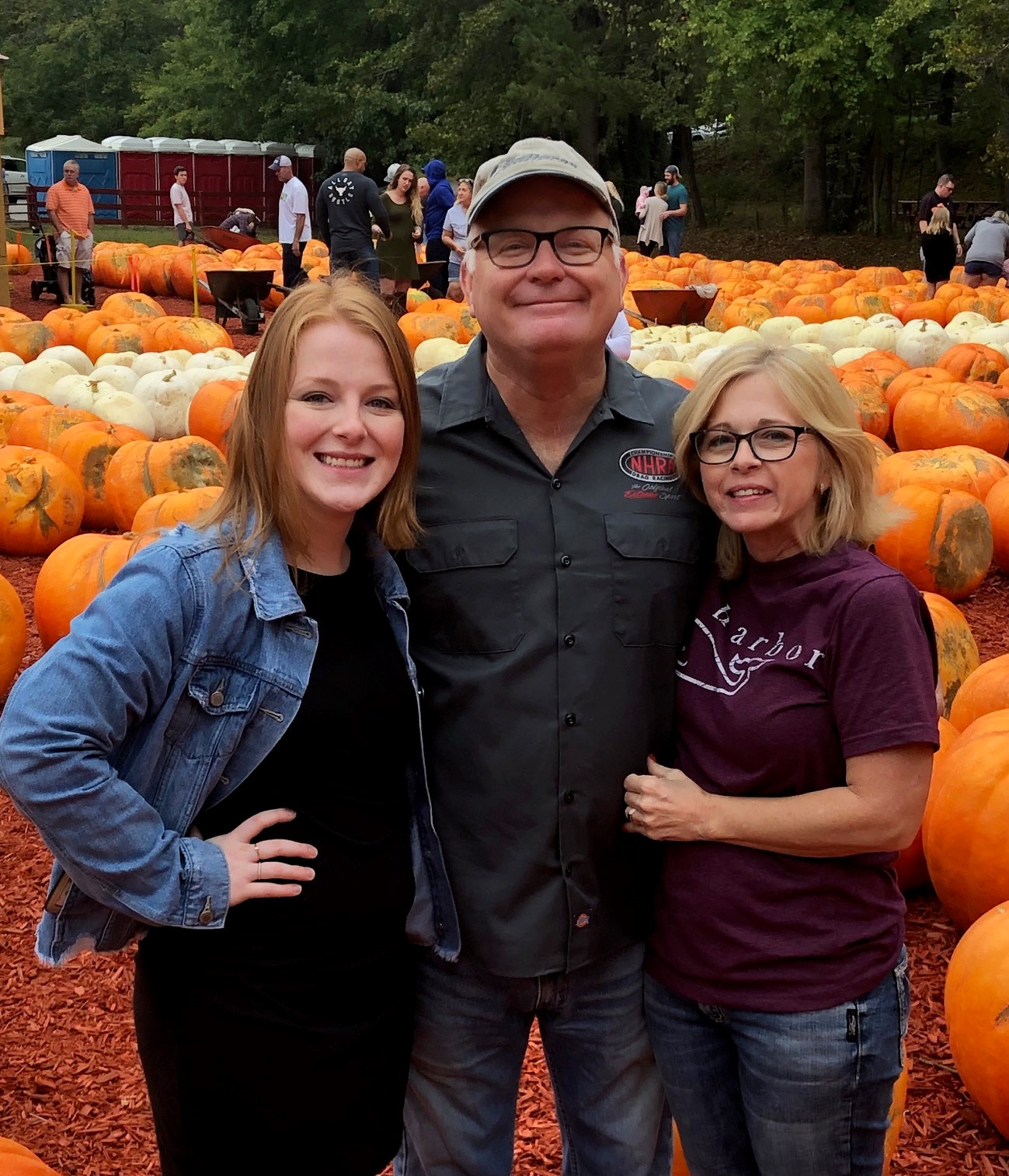 Atlanta attorney Meg Howard with her parents, Rich and Scarlet, at Burt's Pumpkin Farm in Dawsonville, Ga.