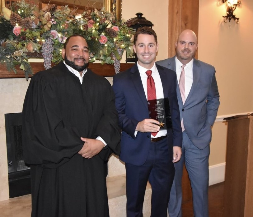 Attorney J.P. Graf was named Outstanding Young Lawyer by the Lafayette Bar Association in 2022. Presenting him the award is Judge Royal Colbert and attorney J. Derek Aswell.