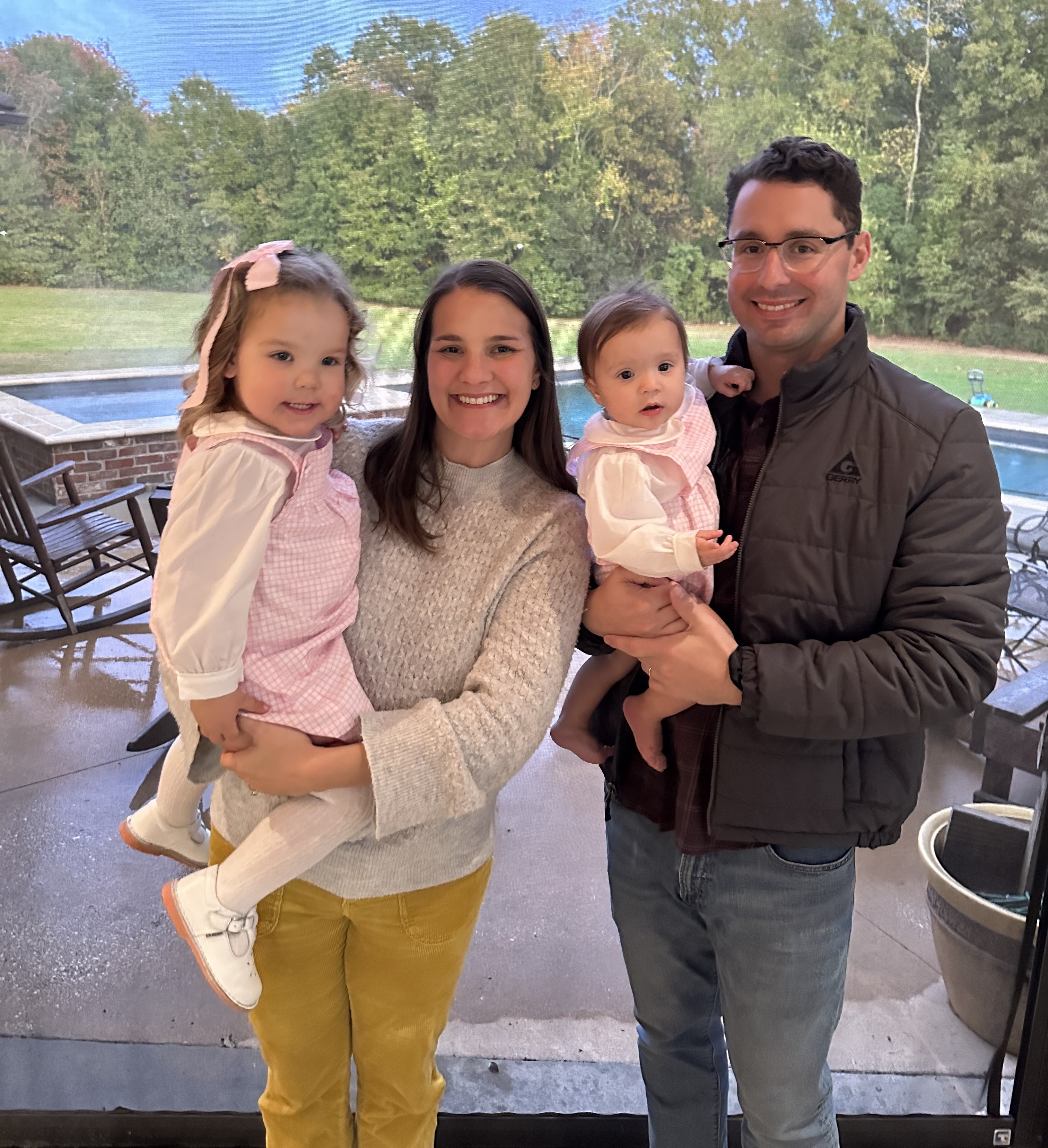 The Graf family: JP and Carli poolside with their daughters Annie and Laura.