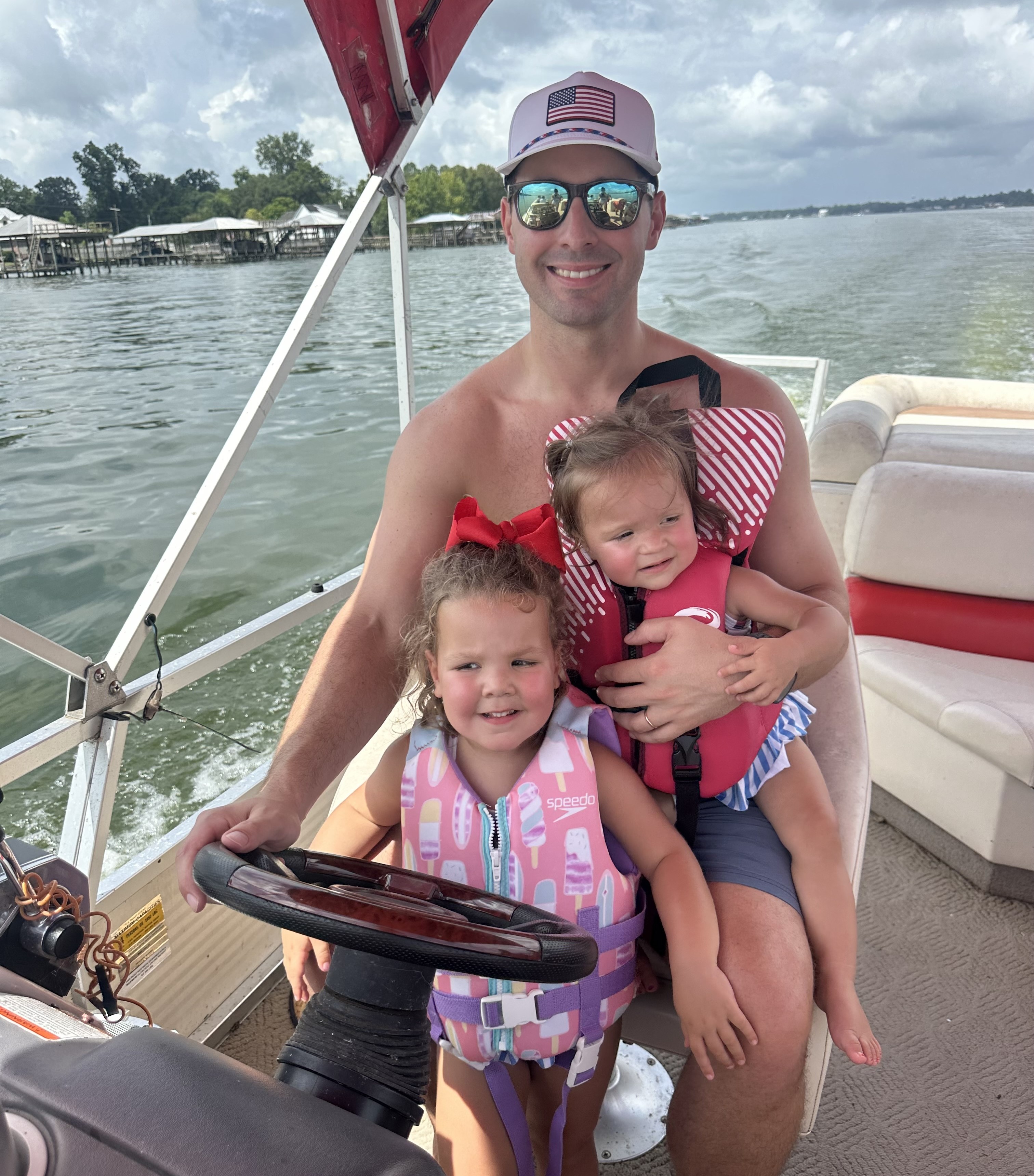 Attorney JP Graf enjoys the waterways of Louisiana with his daughters, Annie and Laura.